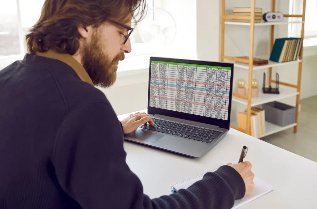 Student practicing MS Excel formulas on a computer during a job-oriented computer course